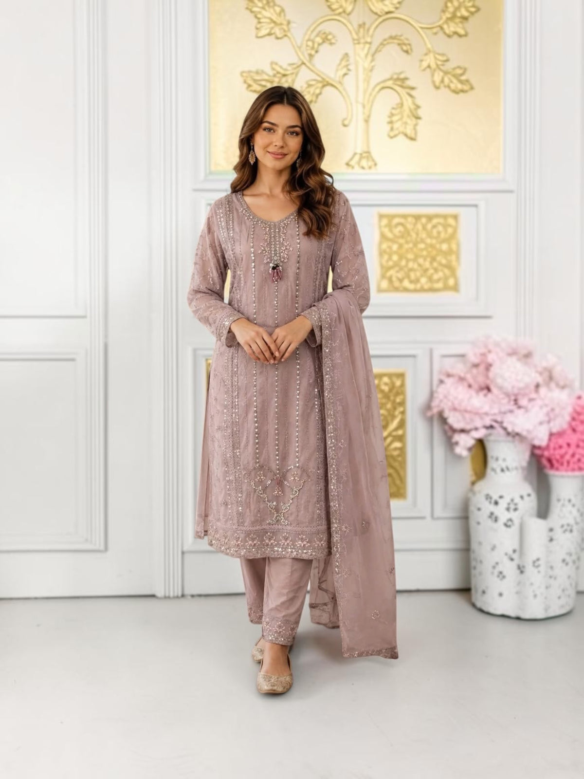 Traditional designer Salwar Kameez set by Saree Ghor Charlotte featuring intricate embroidery and vibrant fabric for women.