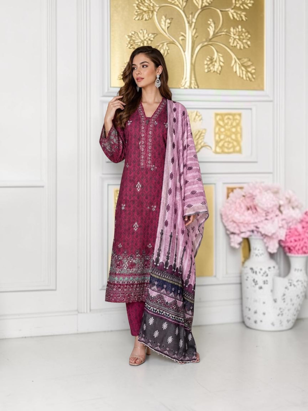 Traditional Pakistani Salwar Kameez for women by Saree Ghor Charlotte, featuring vibrant fabric and intricate embroidery.