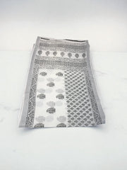 Traditional soft linen print saree by Saree Ghor Charlotte, featuring intricate cultural design and elegant draping for women.