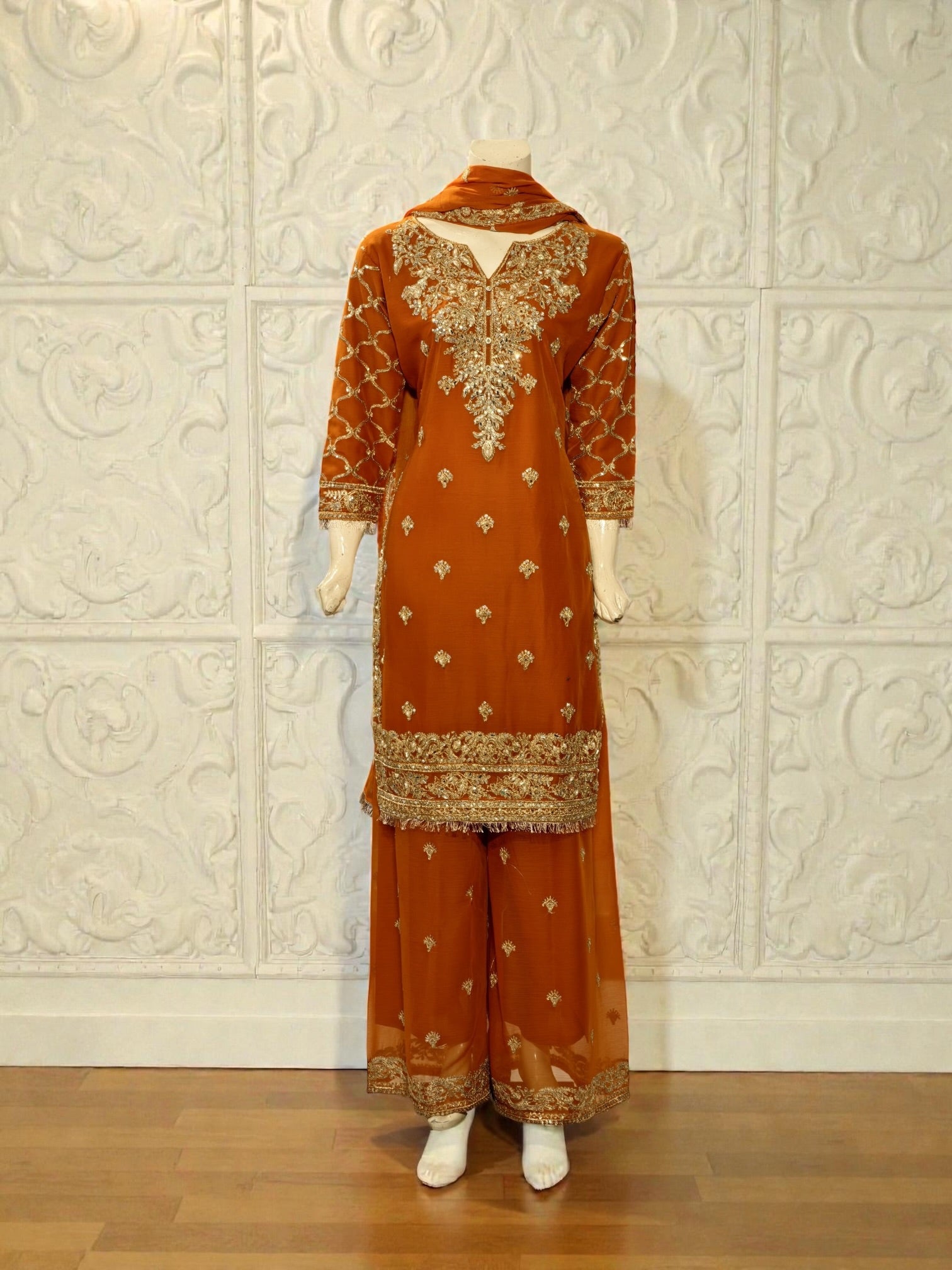 Traditional Saree Ghor Charlotte Salwar Kameez for women featuring colorful fabric and intricate embroidery in a cultural wear style.