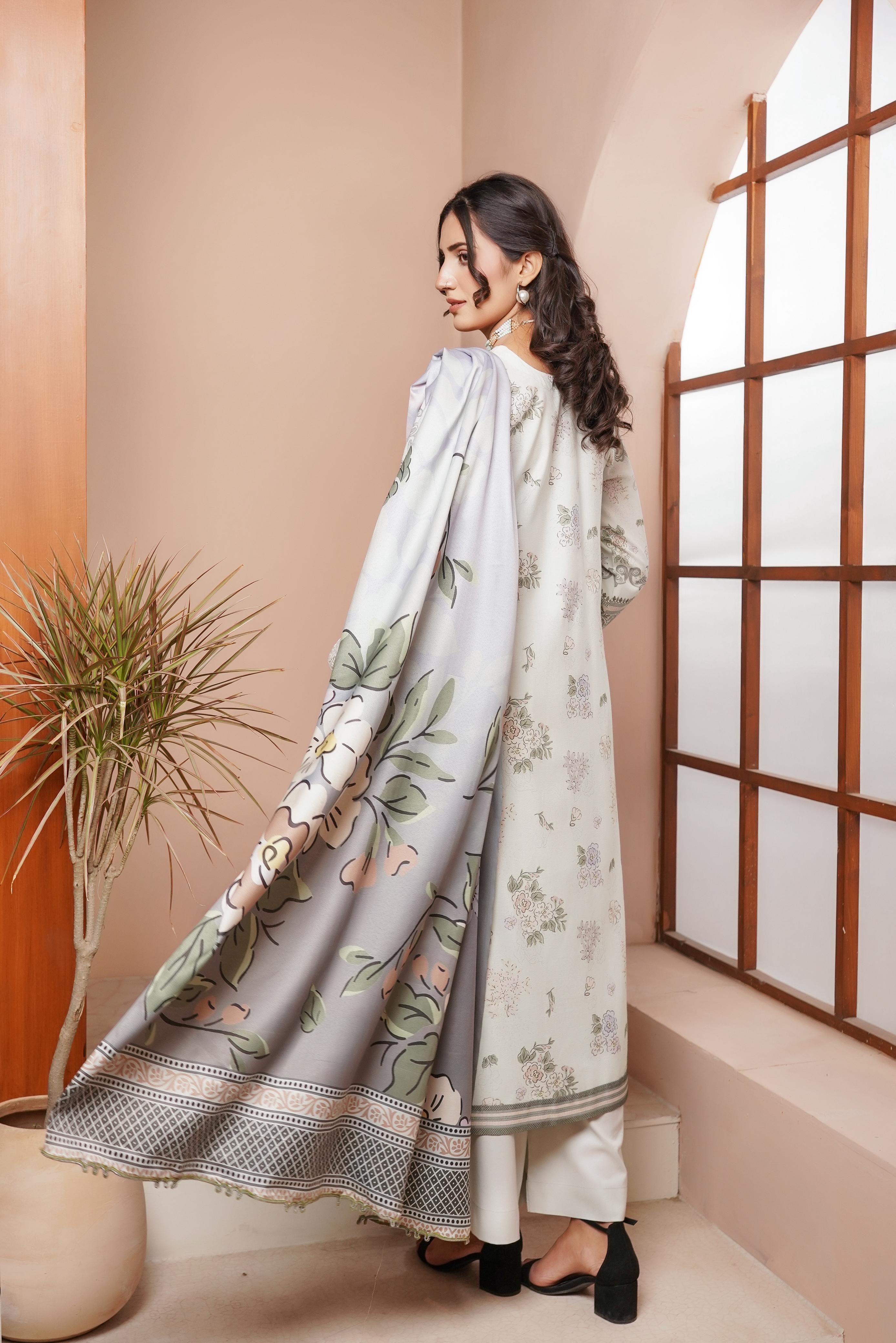 Traditional Pakistani Salwar Kameez for women by Saree Ghor Charlotte, featuring vibrant fabric and intricate embroidery.