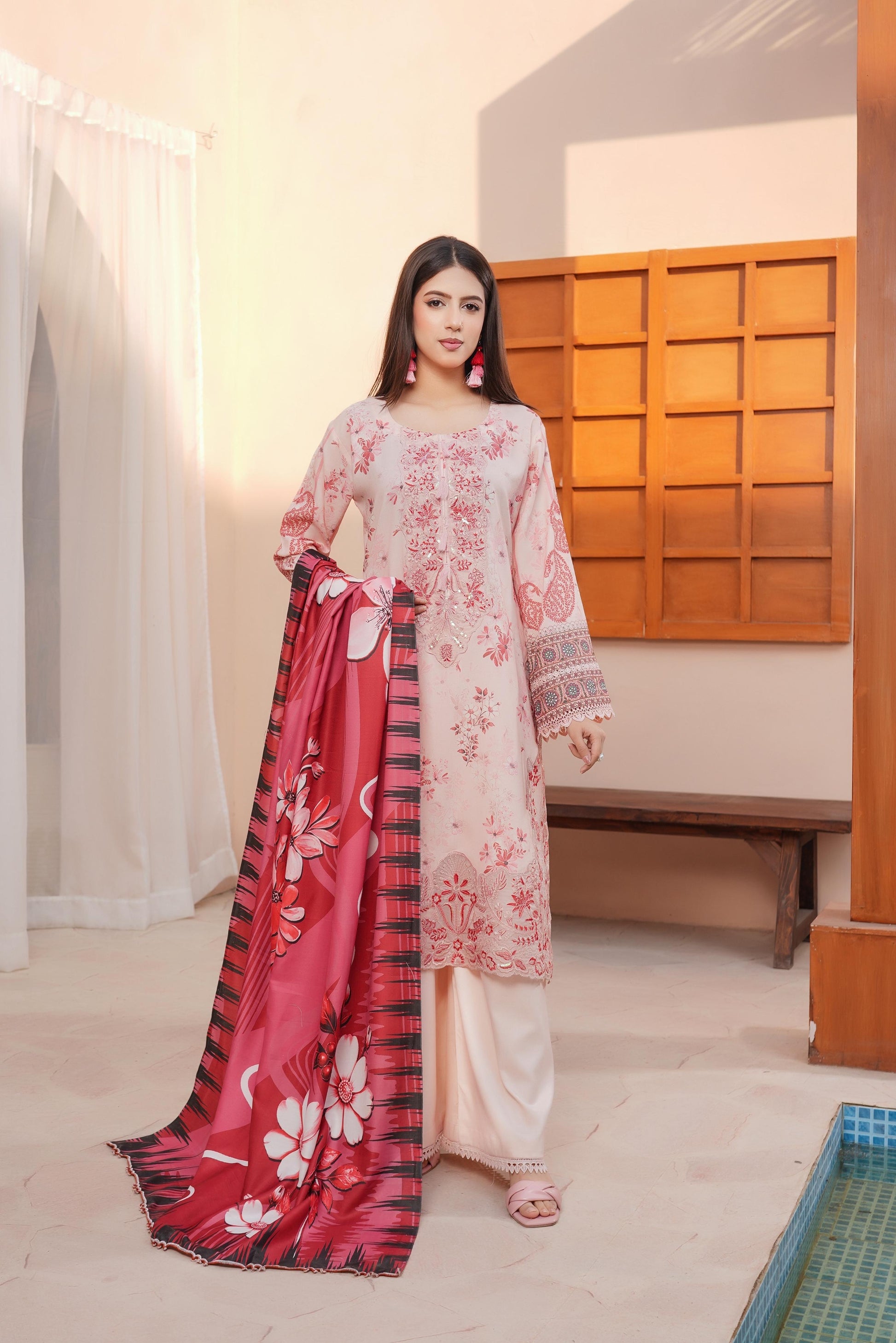 Traditional Pakistani Salwar Kameez for women, featuring intricate embroidery and vibrant colors from Saree Ghor Charlotte.