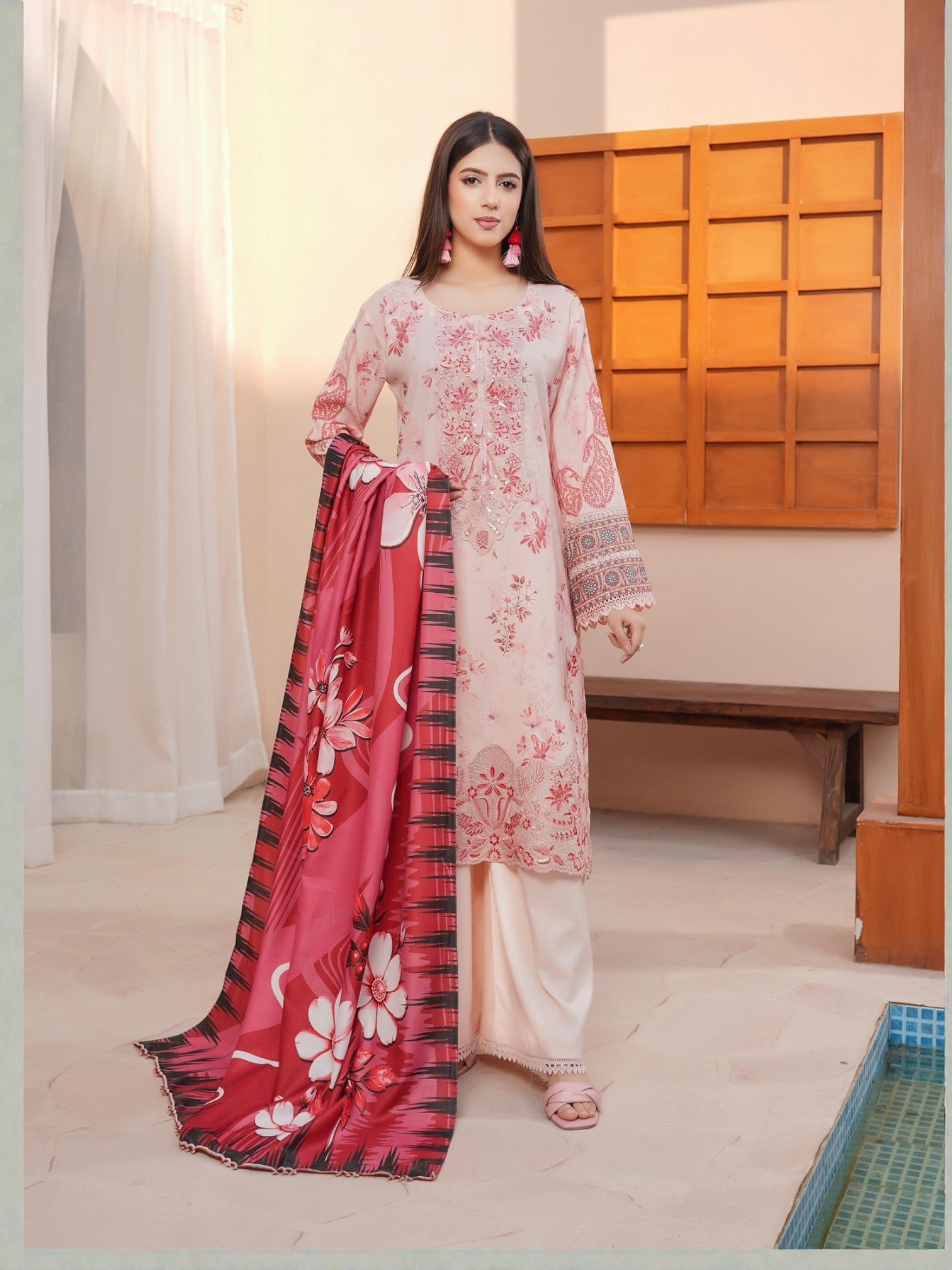 Traditional Pakistani Salwar Kameez for women by Saree Ghor Charlotte, featuring vibrant fabric and intricate embroidery.