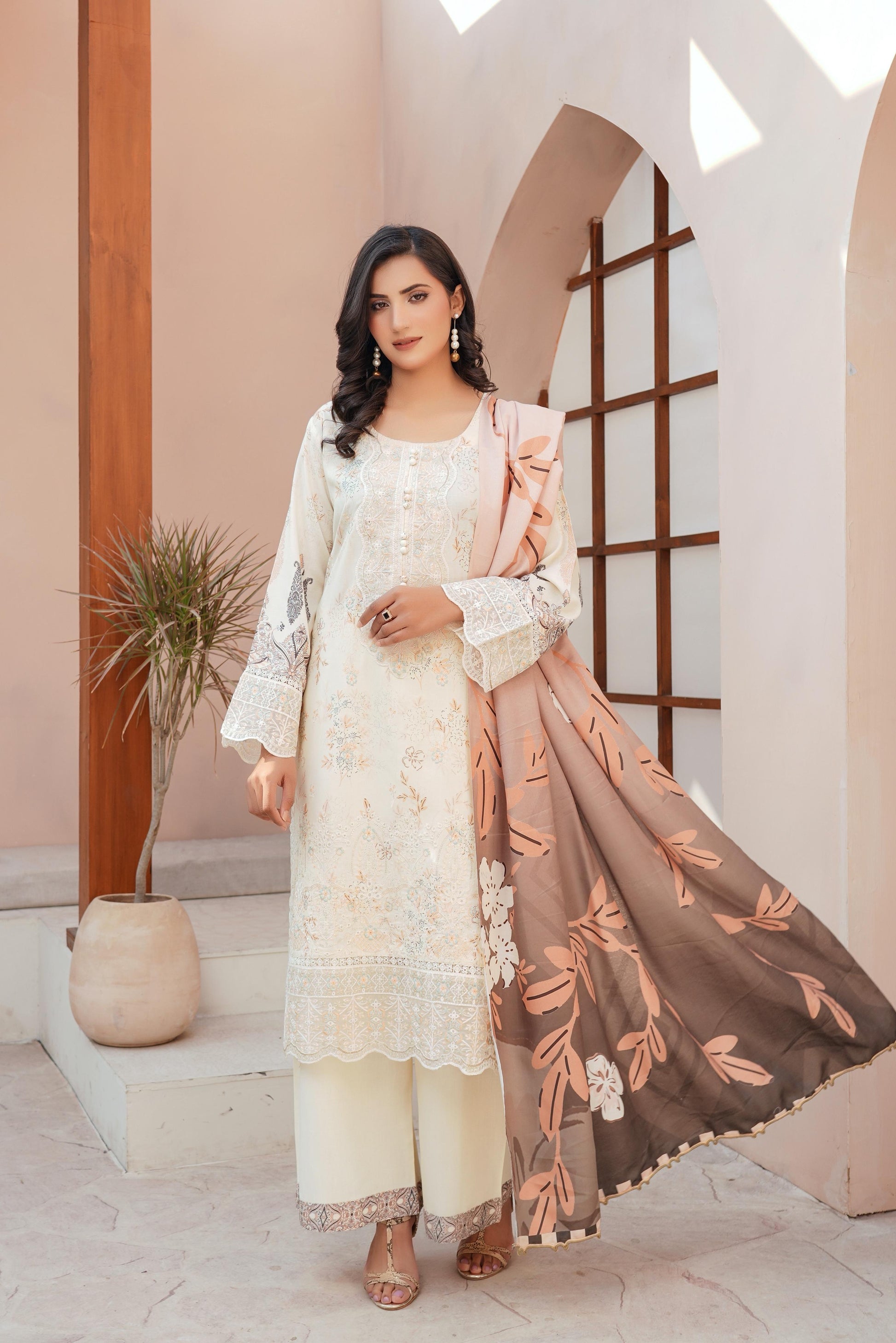 Traditional Pakistani Salwar Kameez for women by Saree Ghor Charlotte, featuring vibrant fabric and intricate embroidery.
