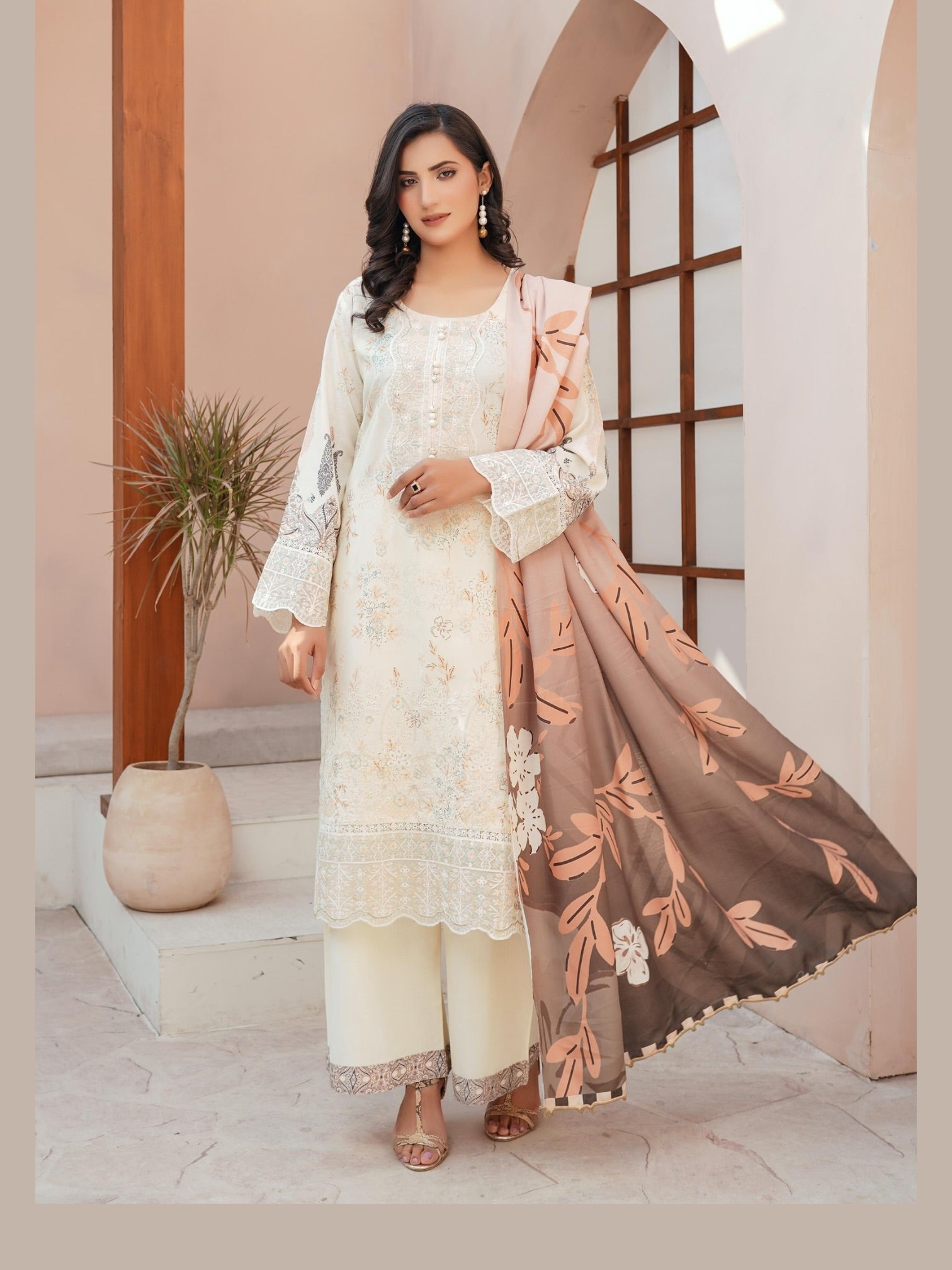 Traditional Pakistani Salwar Kameez for women featuring intricate embroidery and vibrant colors, by Saree Ghor Charlotte.