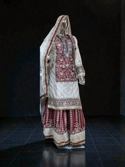 Rangoli Russian Plazo Dress, a vibrant Salwar Kameez for women, showcasing intricate cultural patterns and flowing design.