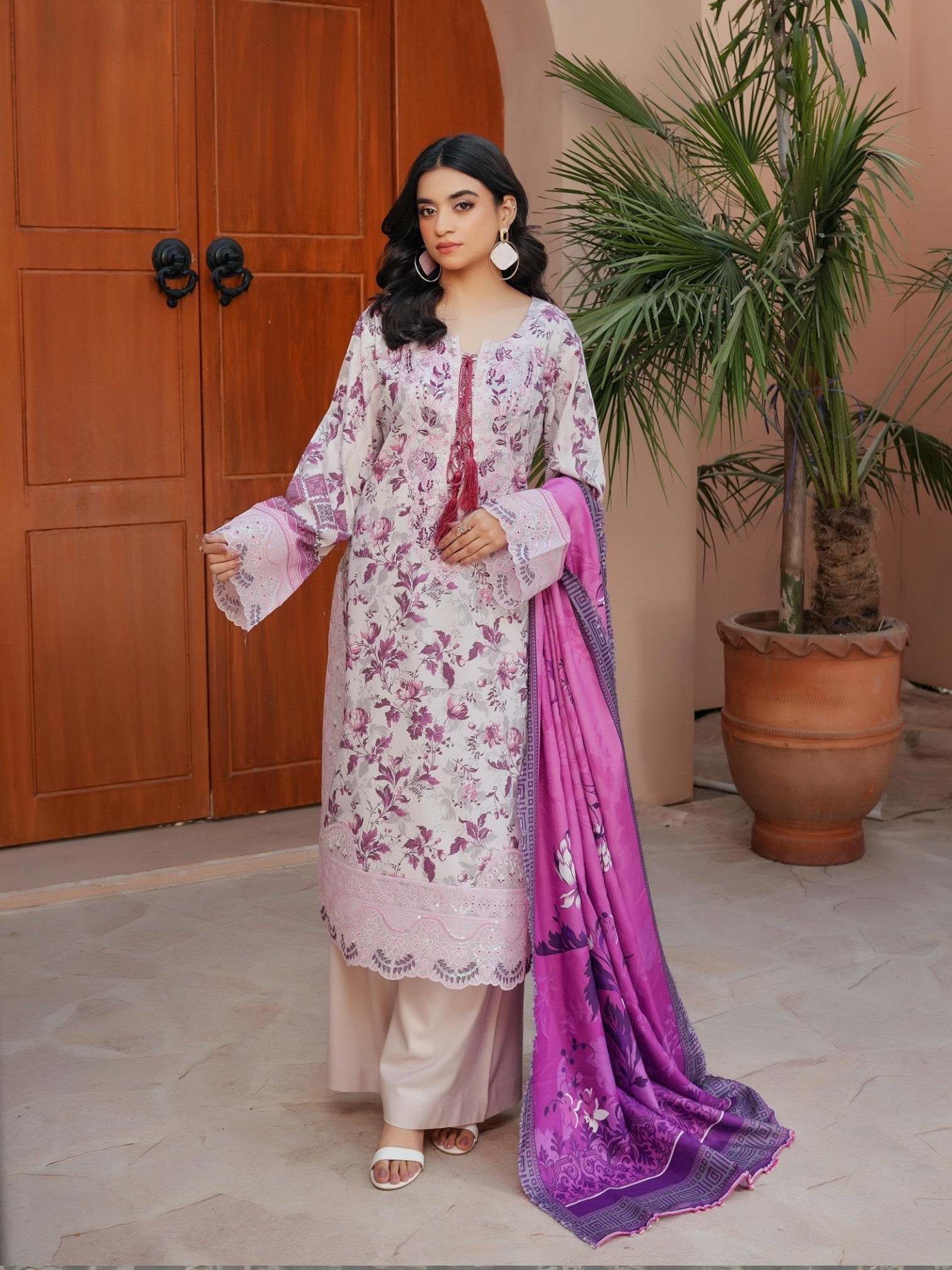 Traditional Pakistani Salwar Kameez by Saree Ghor Charlotte, featuring colorful embroidery and elegant cultural wear for women.