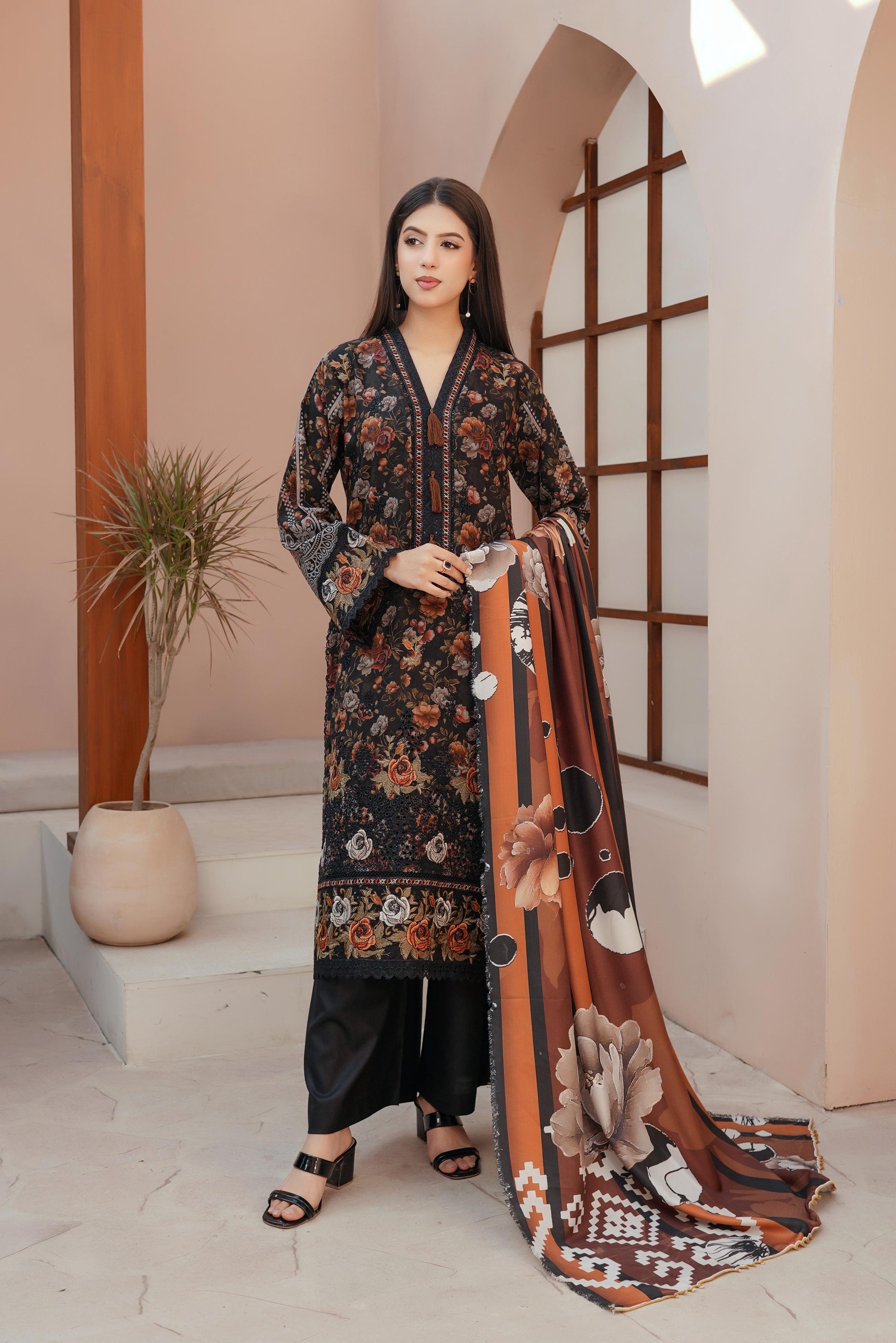Traditional Pakistani Salwar Kameez for women by Saree Ghor Charlotte, featuring vibrant fabric and intricate embroidery.