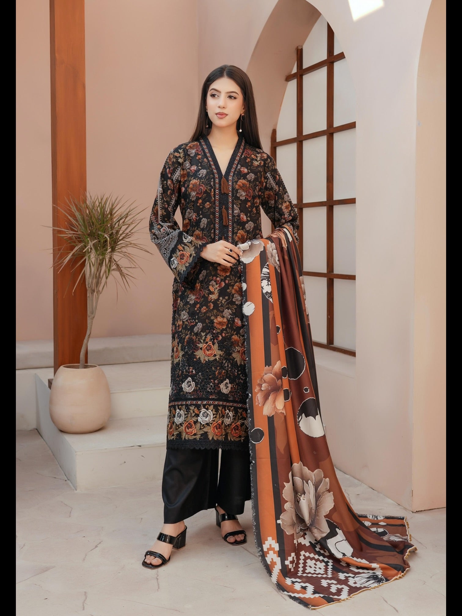 Traditional Pakistani Salwar Kameez for women by Saree Ghor Charlotte, featuring vibrant fabric and intricate embroidery.