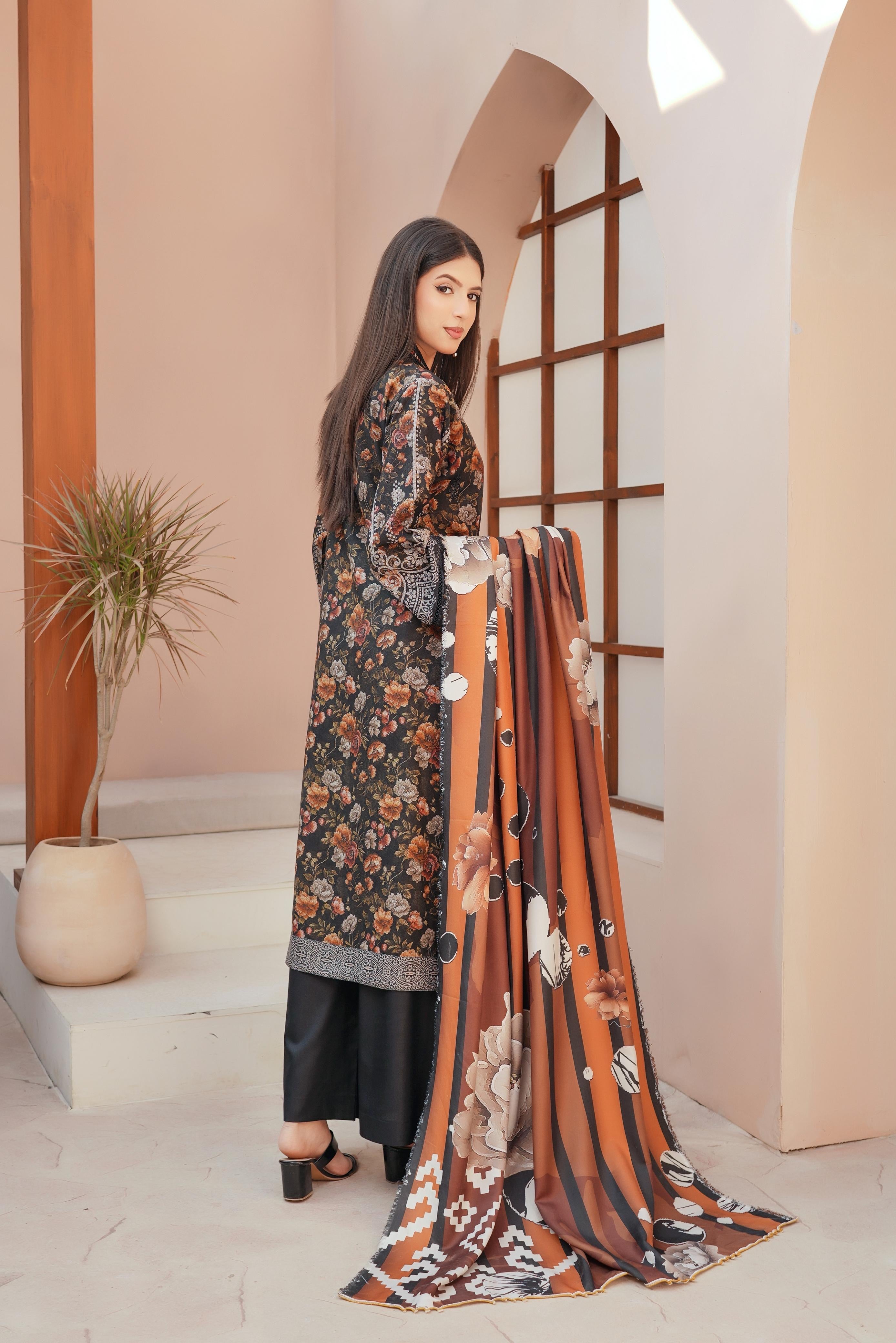 Traditional Pakistani Salwar Kameez for women, featuring vibrant fabric and intricate embroidery from Saree Ghor Charlotte.