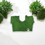Dark green traditional ready-made blouse for saree by Saree Ghor Charlotte, featuring ethnic design and intricate details.
