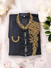 Black soft cotton traditional boys kurta by Saree Ghor Charlotte, suitable for 2-year-olds, shown in a close-up image.