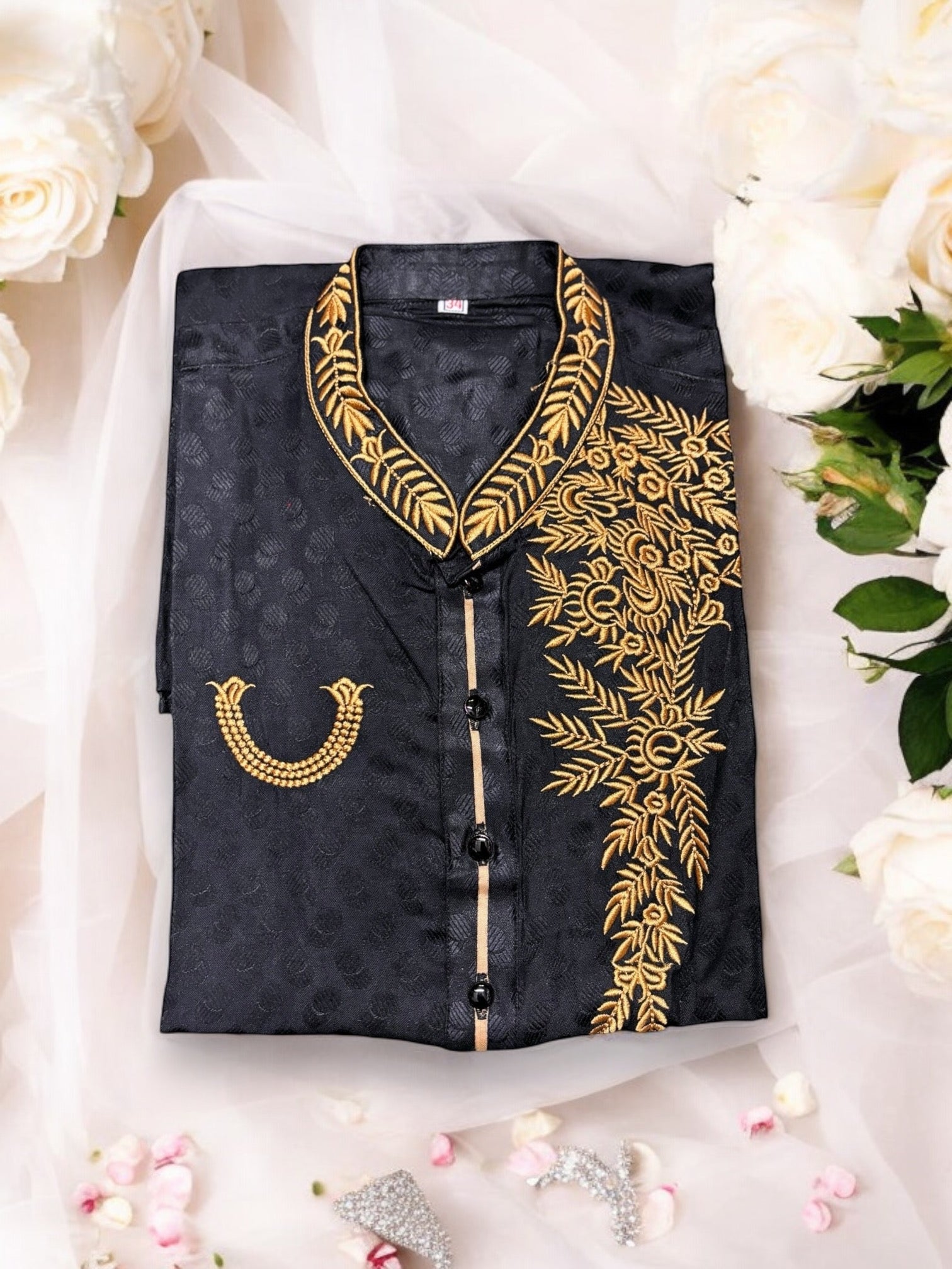 Black soft cotton traditional boys kurta by Saree Ghor Charlotte, suitable for 2-year-olds, shown in a close-up image.