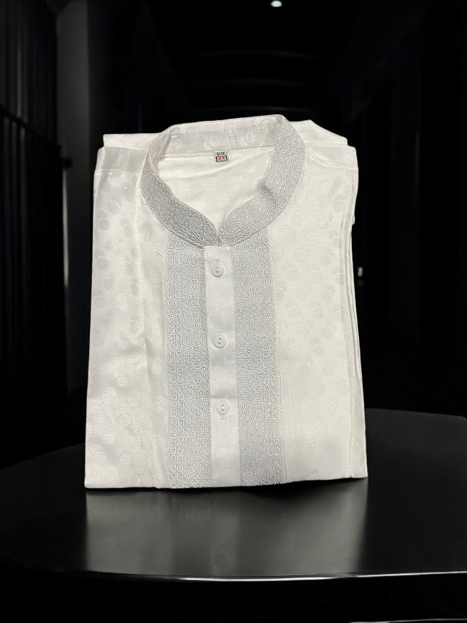White cotton boys kurta from Saree Ghor Charlotte featuring a classic design, traditional cultural wear for young boys.