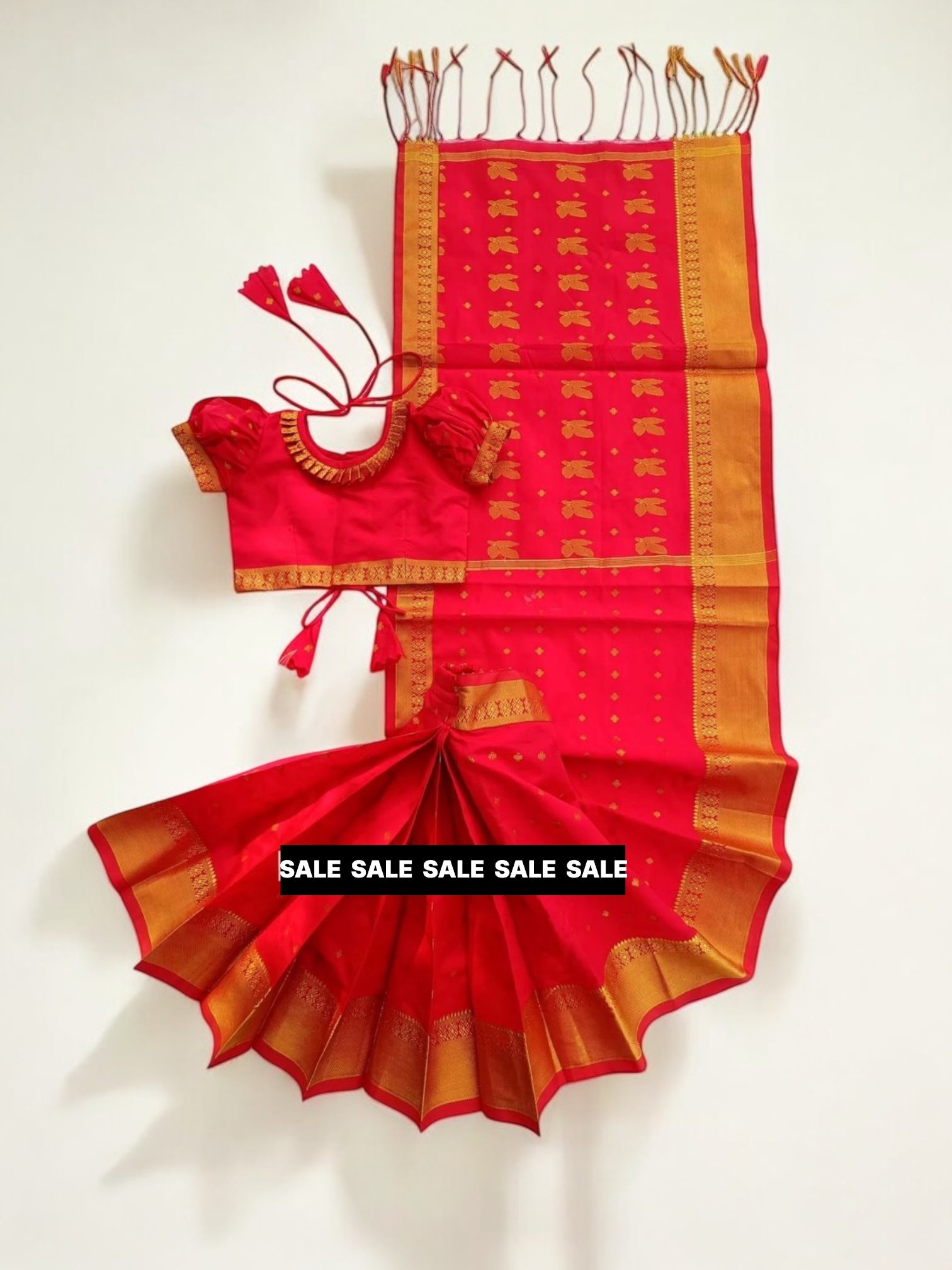 Girl wearing a traditional ready-to-wear saree from Saree Ghor Charlotte, colorful ethnic wear for kids.