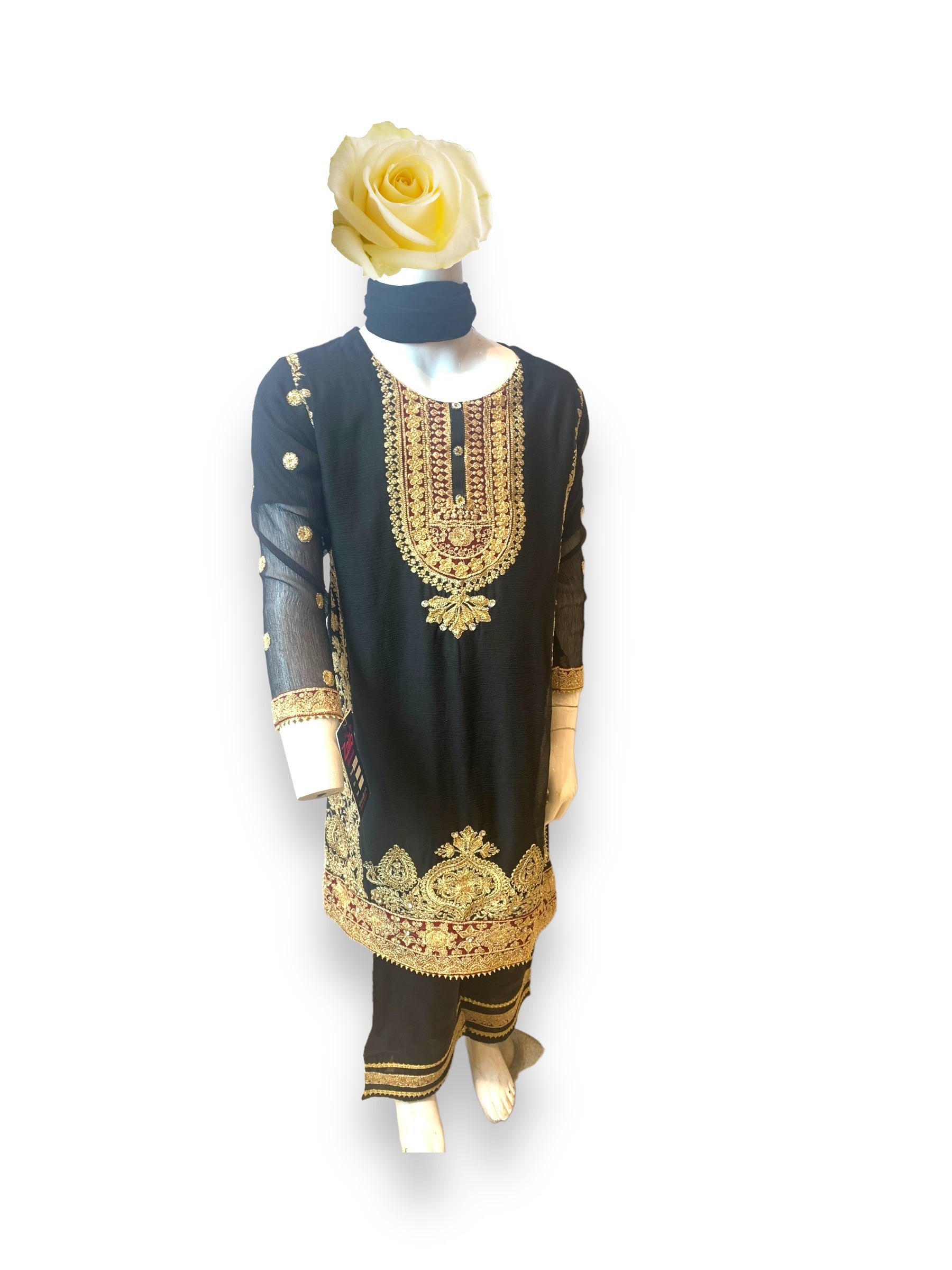 Little girl wearing a stylish designer Salwar Kameez for girls aged 6-12 months, by Saree Ghor Charlotte, in elegant ethnic wear.