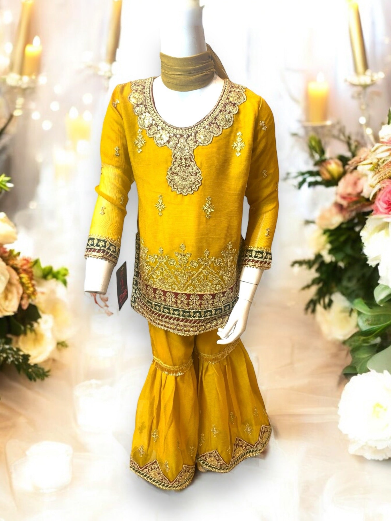 Little girl wearing a stylish designer Salwar Kameez by Saree Ghor Charlotte, featuring elegant traditional ethnic wear.