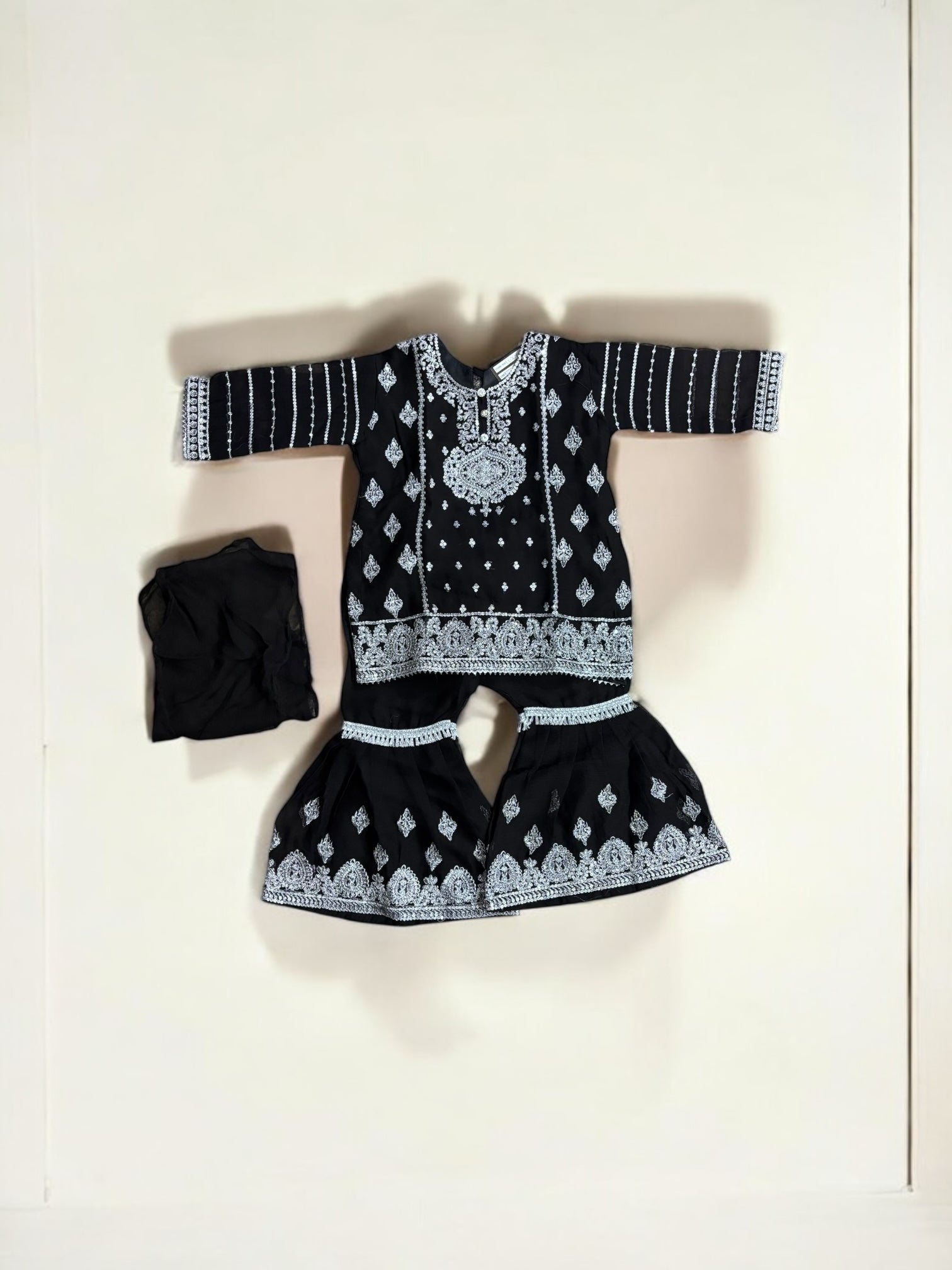 Little girl wearing a stylish designer Salwar Kameez by Saree Ghor Charlotte, elegant ethnic wear for girls aged 6-12 months.