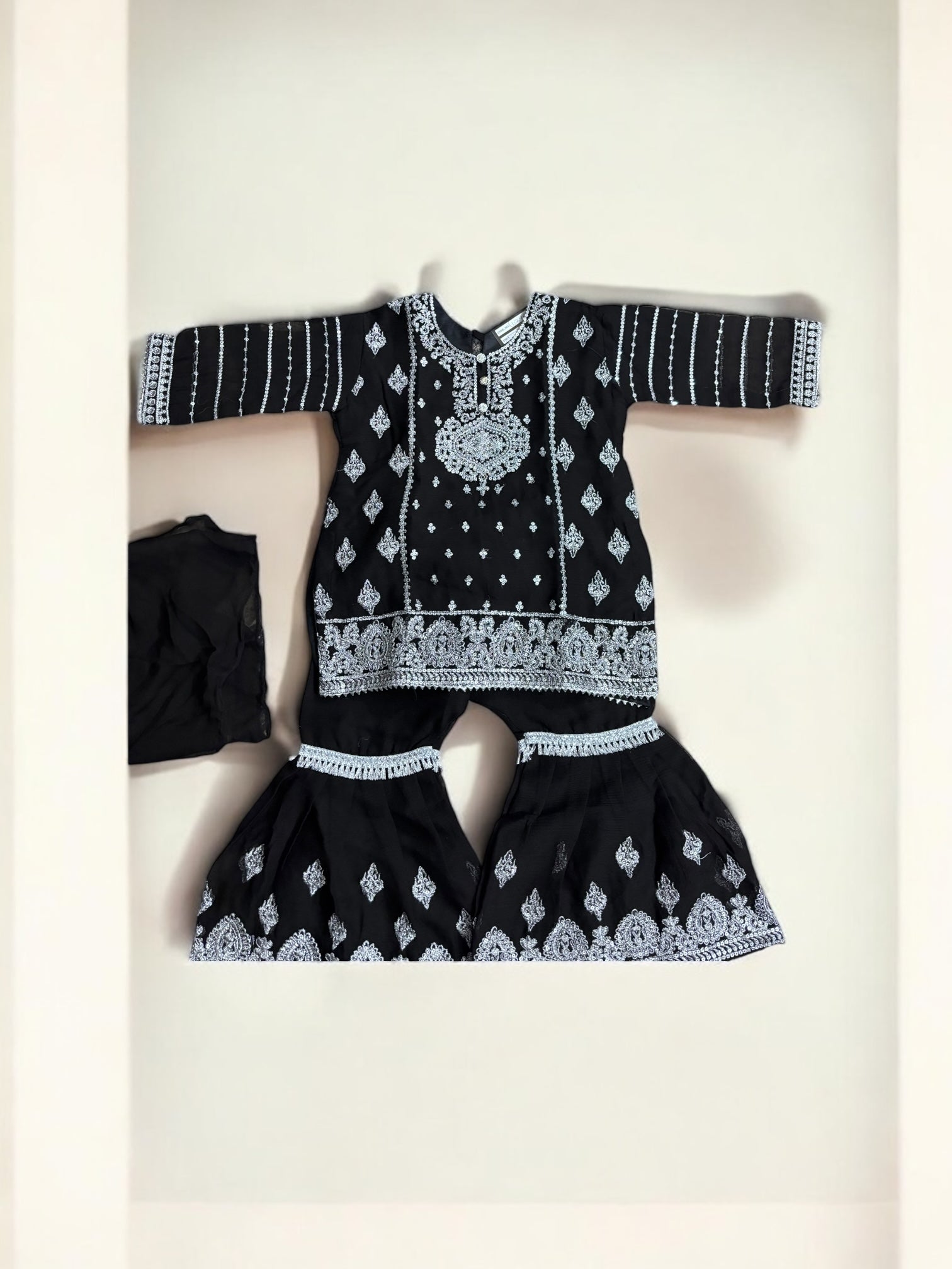 Elegant designer Salwar Kameez for little girls, floral pattern, pink and gold colors, from Saree Ghor Charlotte, suitable for cultural occasions.