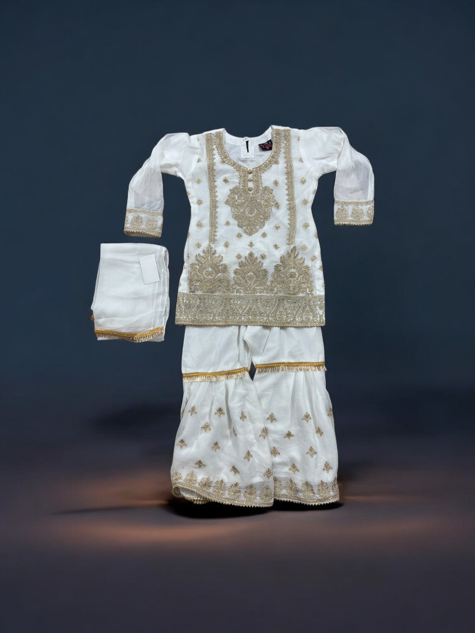 Little girl wearing a traditional designer Salwar Kameez by Saree Ghor Charlotte, featuring elegant, stylish ethnic wear for girls aged 6-12 months.