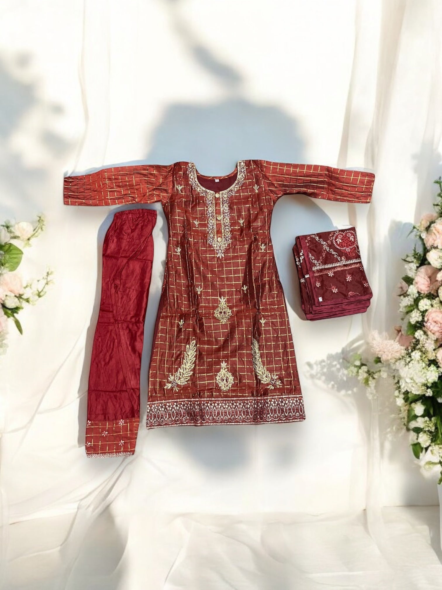 Traditional cotton salwar kameez set for girls, ethnic wear by Saree Ghor Charlotte, featuring colorful fabric and intricate designs.