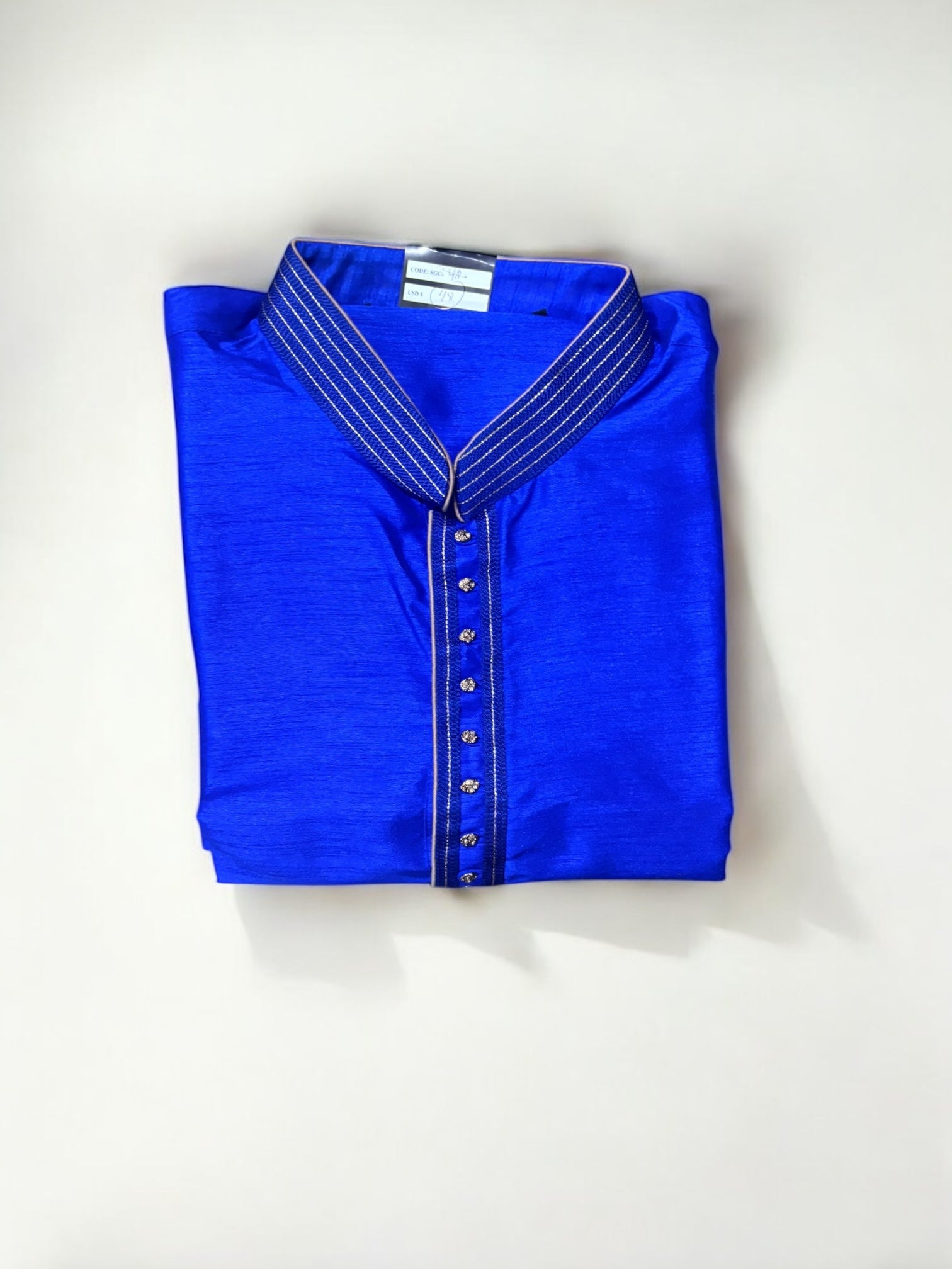 Traditional men's kurta by Saree Ghor Charlotte, made of light fabric, featuring a classic design suitable for cultural wear.