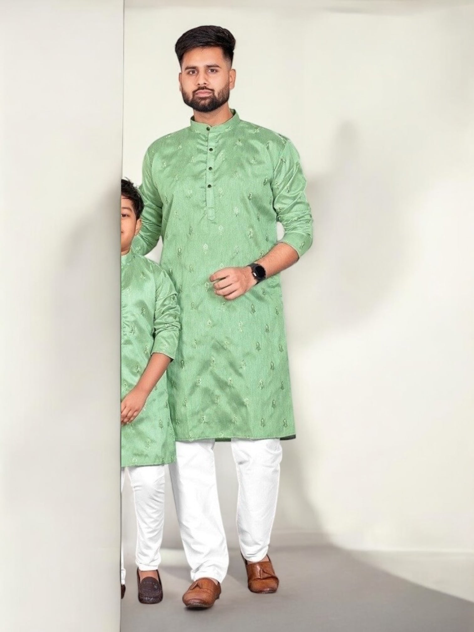 Light green traditional men's kurta and pajama set by Saree Ghor Charlotte, showcasing ethnic wear with intricate details.
