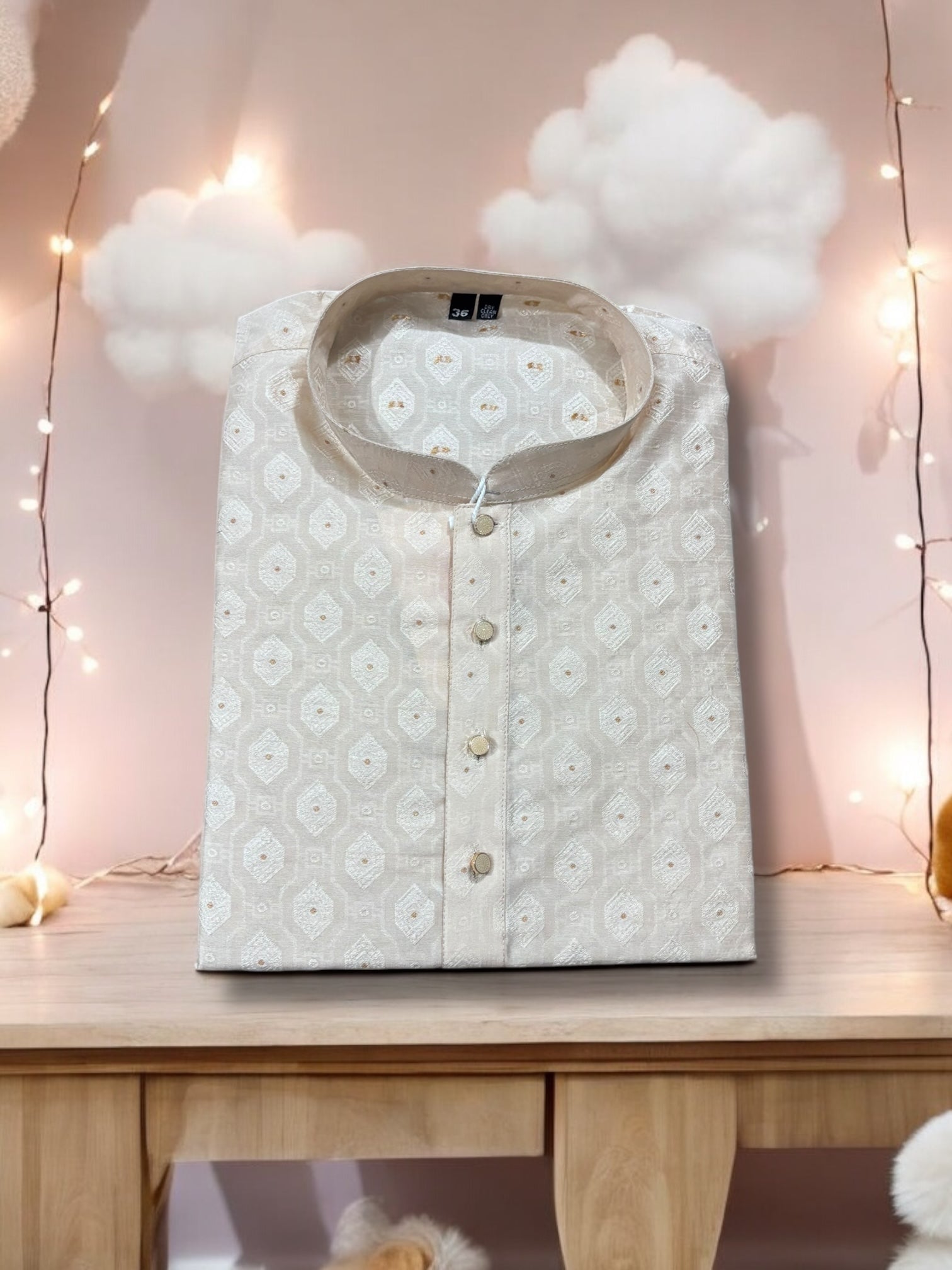 Cream silk men's kurta by Saree Ghor Charlotte featuring traditional ethnic wear design and intricate detailing.