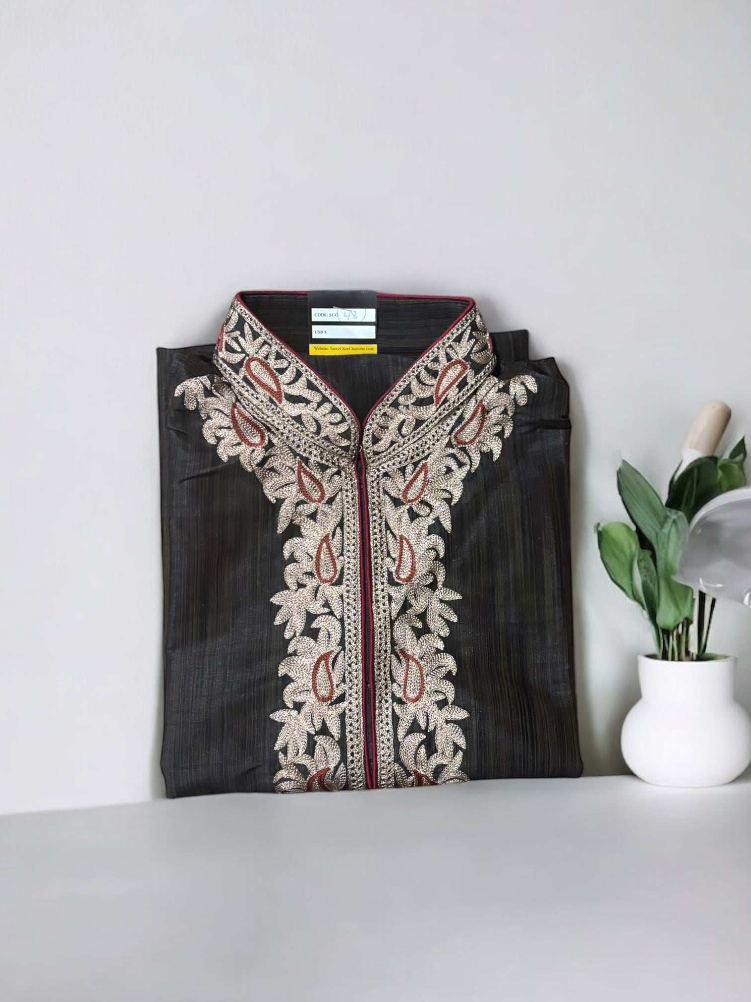 Traditional men's kurta by Saree Ghor Charlotte, showcasing a classic ethnic wear design in vibrant fabric and detailed embroidery.