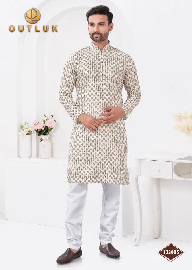 Traditional men's Kurta Pajama set by Saree Ghor Charlotte, featuring a white kurta with intricate embroidery and matching pajama.