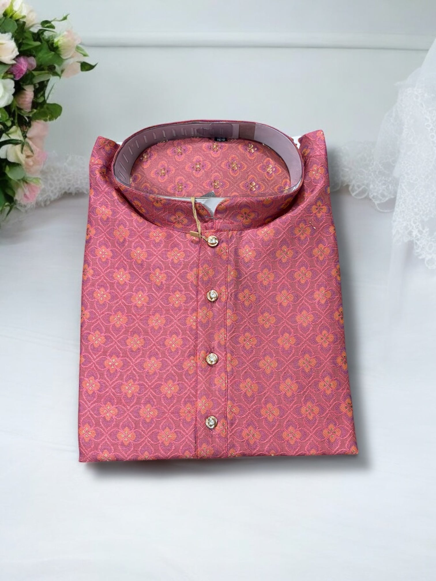 Men's onion pink silk kurta from Saree Ghor Charlotte, traditional ethnic wear with intricate embroidery and a classic fit.