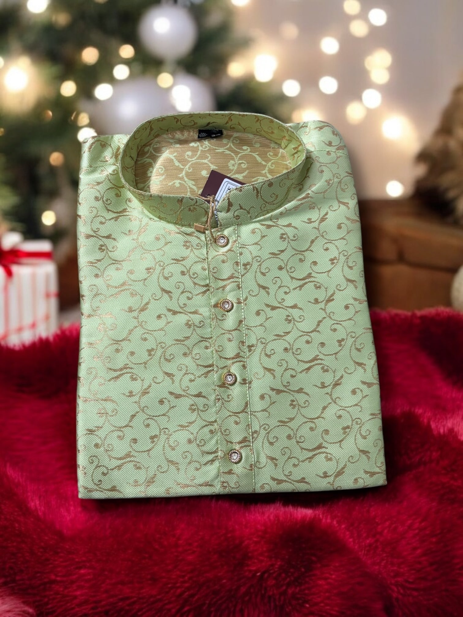 Traditional men's pista green silk kurta by Saree Ghor Charlotte, showcasing ethnic wear with detailed craftsmanship.