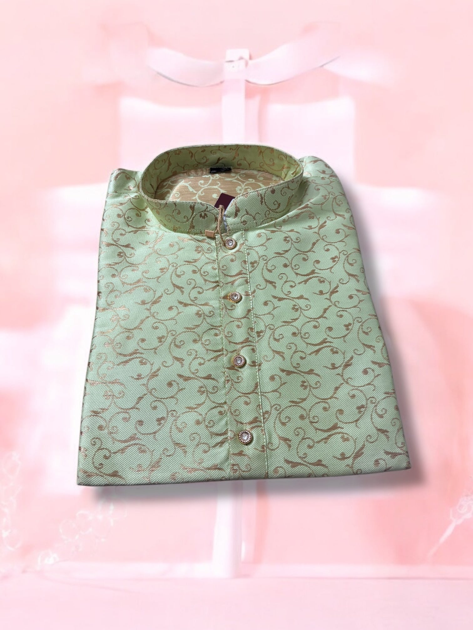 Traditional men's pista green silk kurta by Saree Ghor Charlotte, showcasing intricate ethnic design and elegant fit.