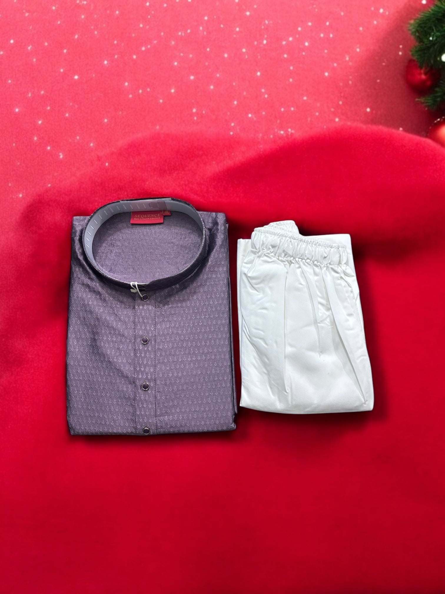 Traditional men's wine color silk kurta pajama set by Saree Ghor Charlotte, featuring intricate ethnic design and elegant fabric.