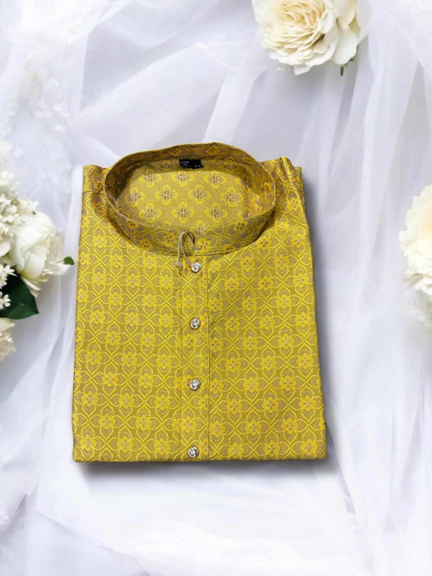 Traditional men's yellow silk kurta by Saree Ghor Charlotte, showcasing intricate ethnic wear design for cultural occasions.