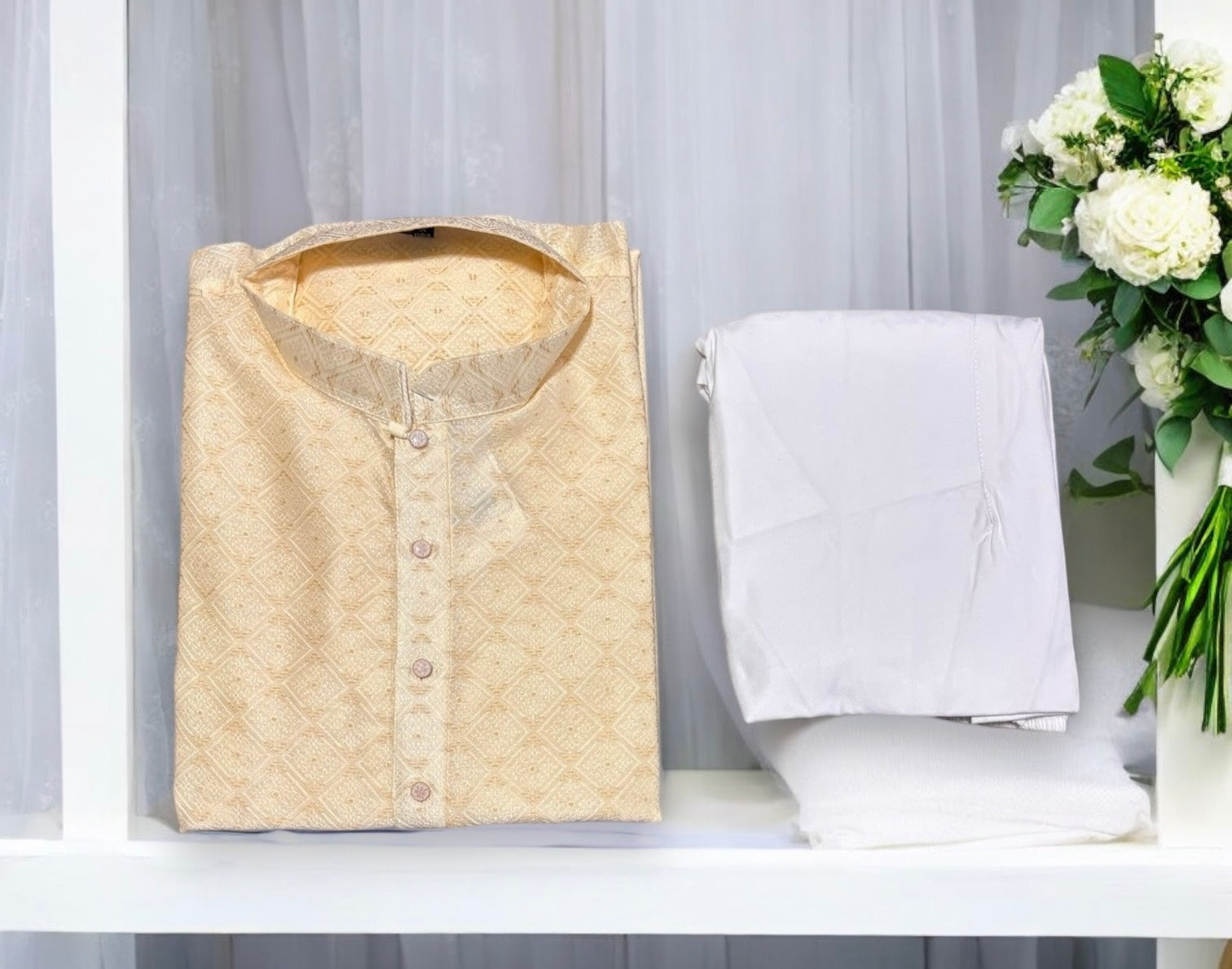 Men's cream silk kurta and pajama set by Saree Ghor Charlotte, traditional Indian attire with intricate details.
