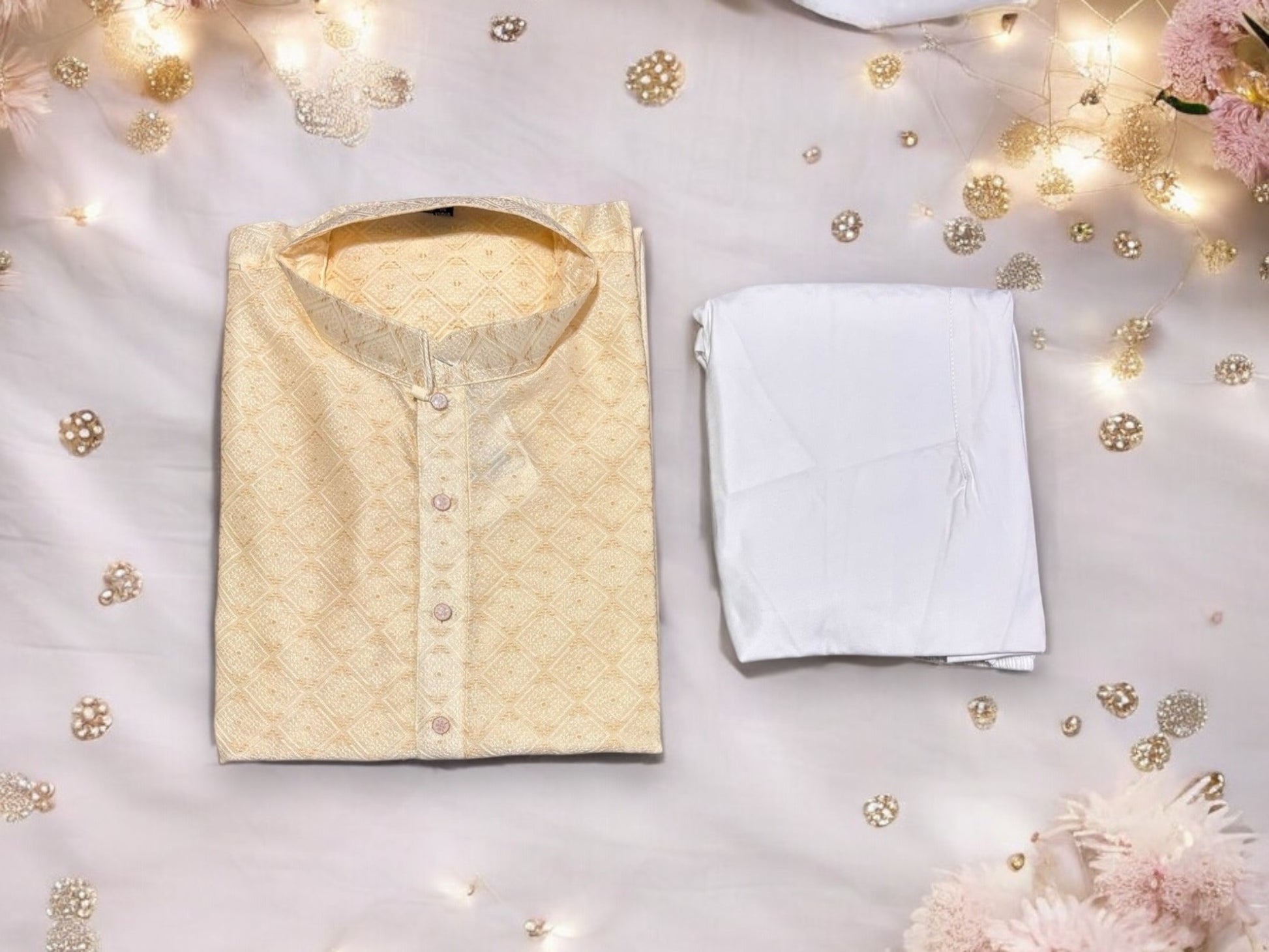 Men's cream silk kurta pajama from Saree Ghor Charlotte, traditional Indian men's kurta with intricate design details.