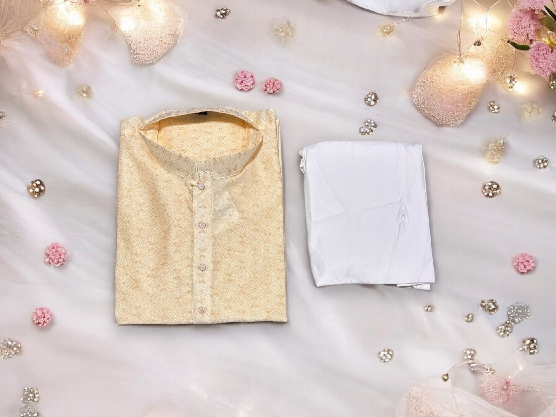 Men's cream silk kurta and pajama set by Saree Ghor Charlotte, traditional Indian men's clothing with intricate design details.