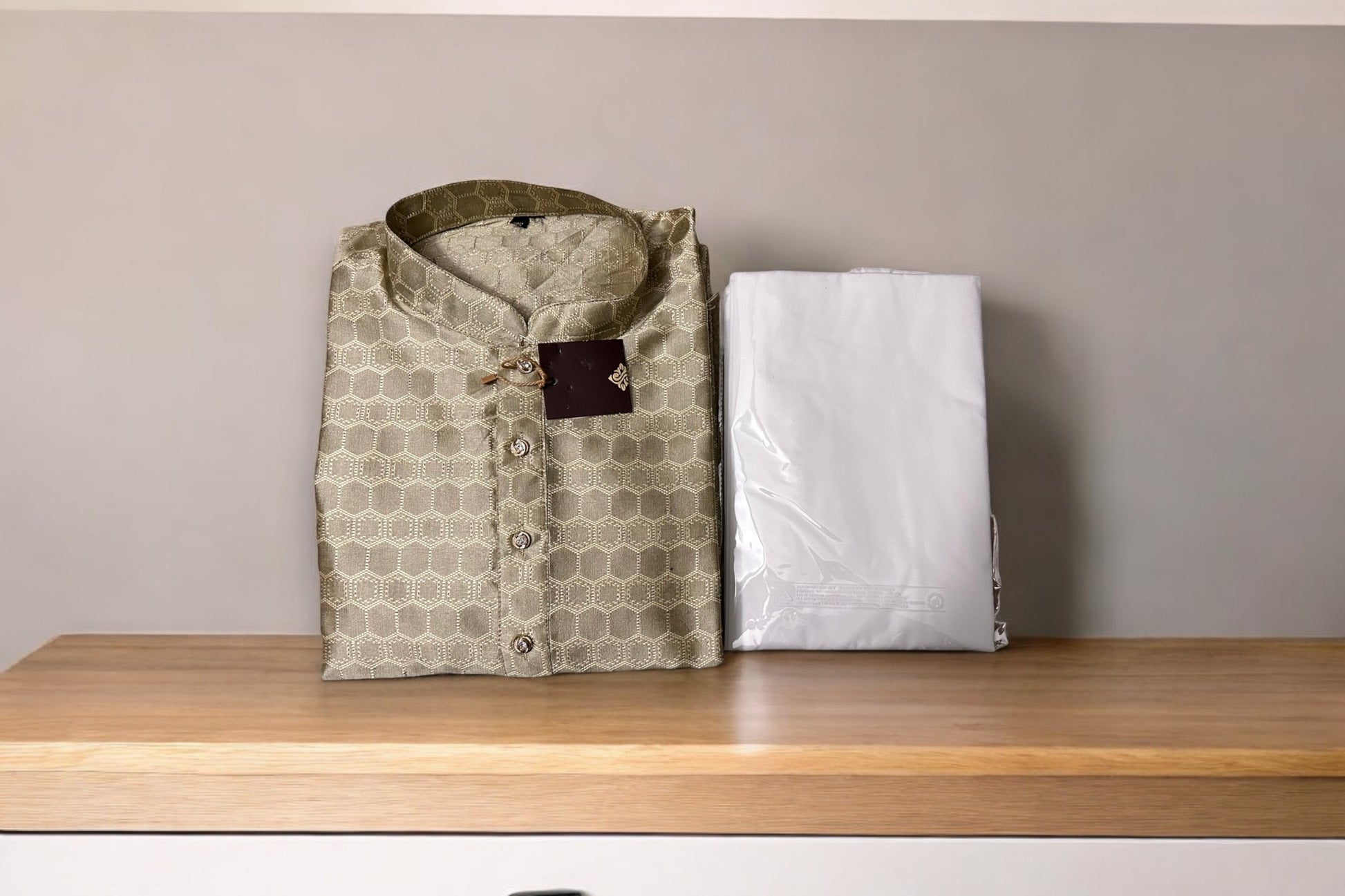 Men's gray traditional silk kurta with matching pajama, casual ethnic wear by Saree Ghor Charlotte, displayed on a hanger.