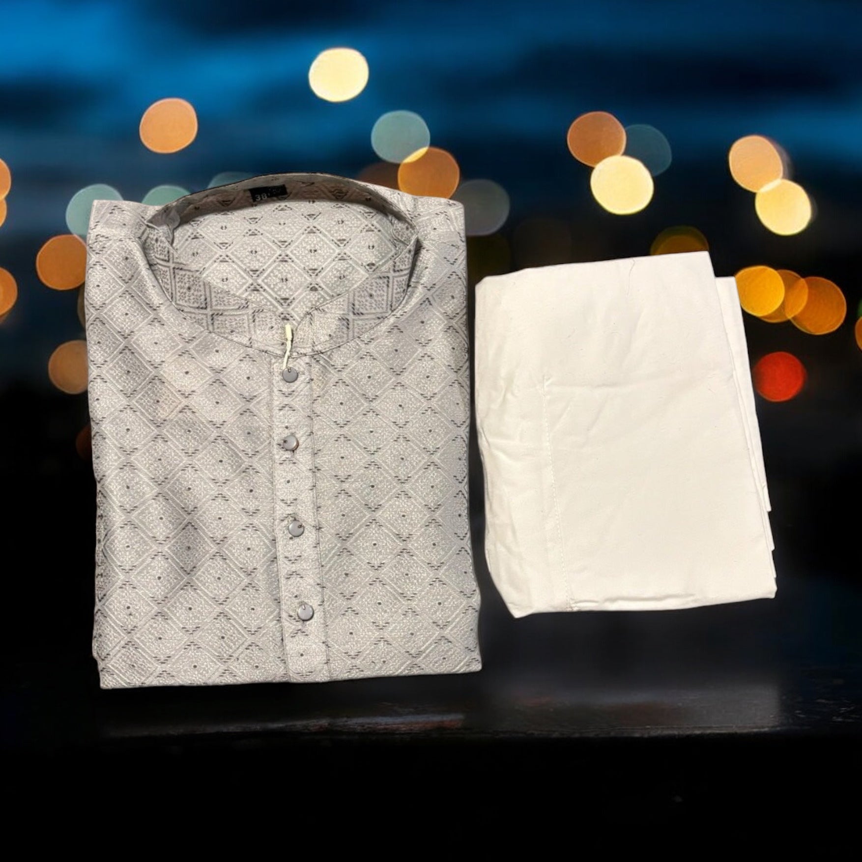 Men's traditional gray silk kurta and pajama set by Saree Ghor Charlotte, featuring classic design and elegant fabric.