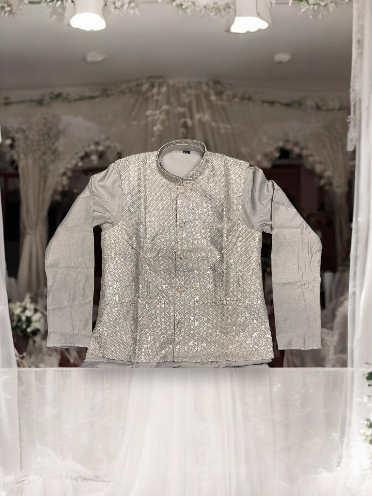 Traditional gray silk men's kurta set with matching pant and coat from Saree Ghor Charlotte, featuring intricate detailing.