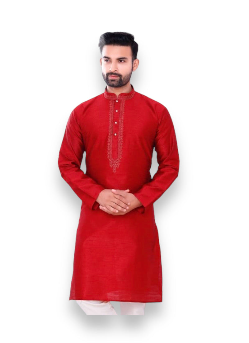 Traditional men's silk kurta and pajama set in elegant design, worn by a model showcasing cultural ethnic wear.