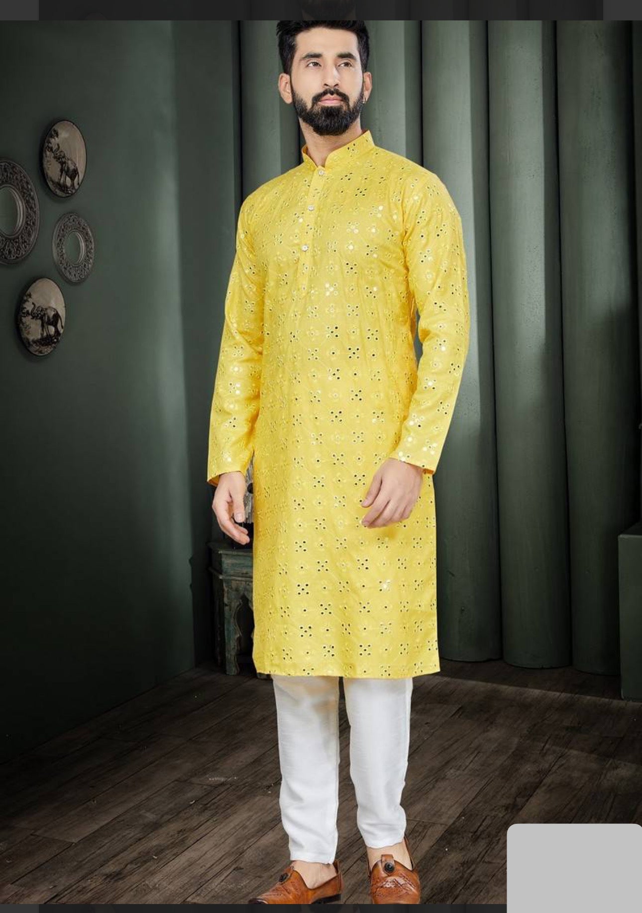 Traditional yellow men's kurta and pajama set by Saree Ghor Charlotte, ideal for party wear, shown in a catalog image.
