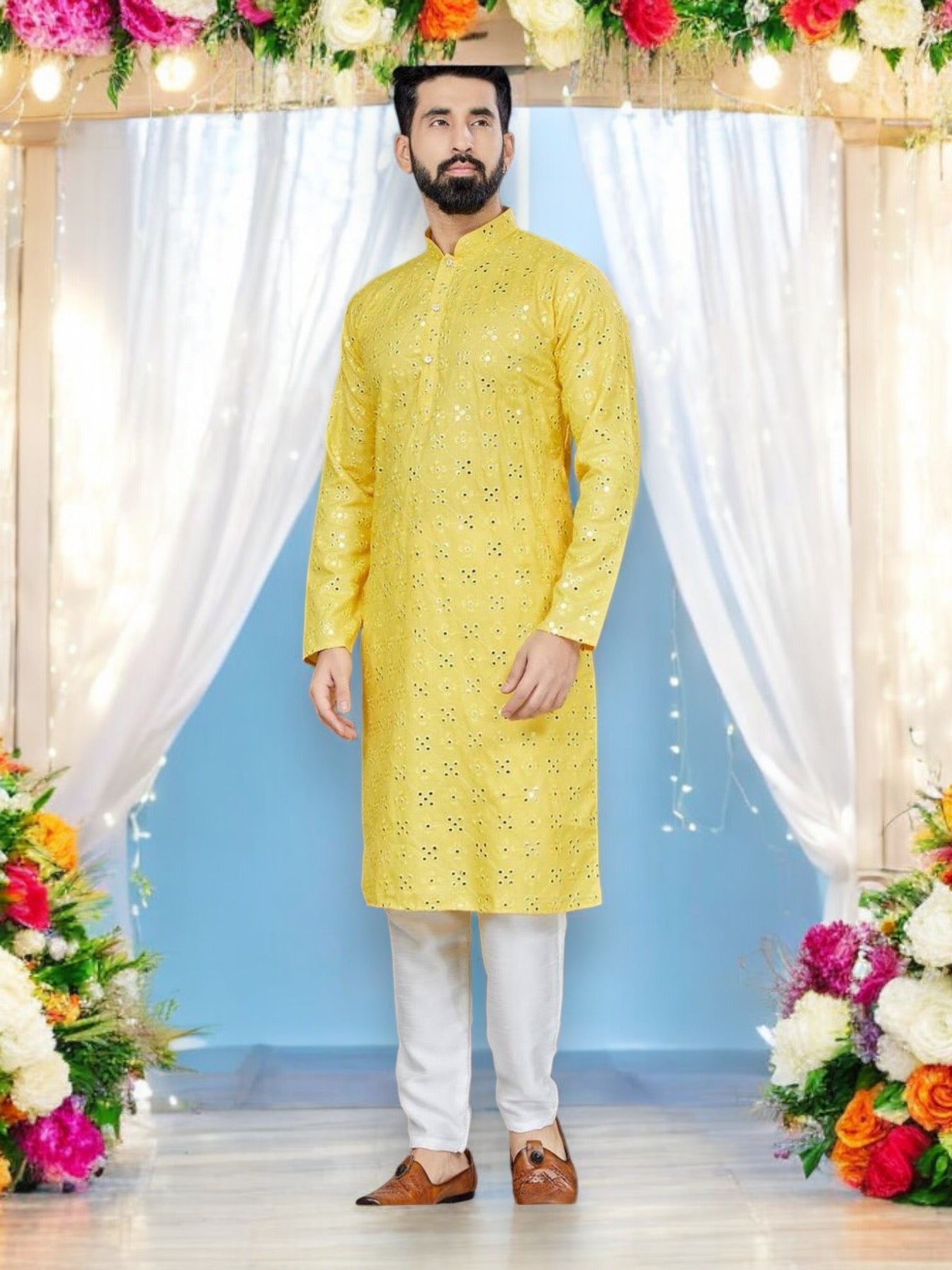 Traditional yellow men's kurta and pajama set from Saree Ghor Charlotte, ideal for party wear, shown in a catalog image.