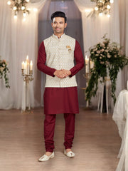 Men's maroon traditional cotton kurta pajama set with an elegant jacket by Saree Ghor Charlotte, showcasing intricate design and classic style.