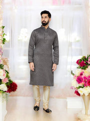 Traditional black jacquard men's kurta pajama set by Saree Ghor Charlotte, showcasing intricate ethnic design and classic style.