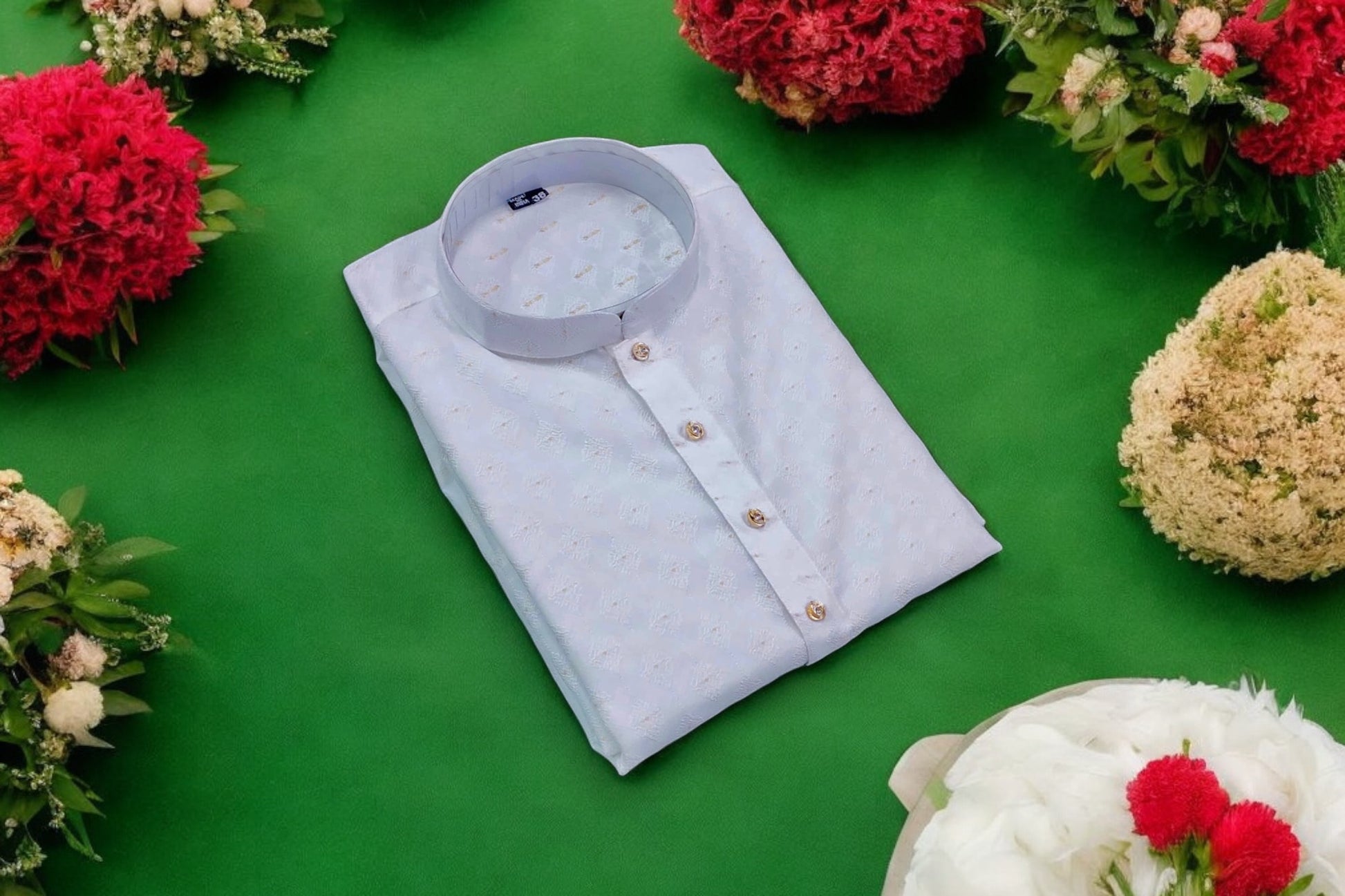 Men's traditional white silk kurta with matching pants from Saree Ghor Charlotte, showcasing elegant craftsmanship and classic style.