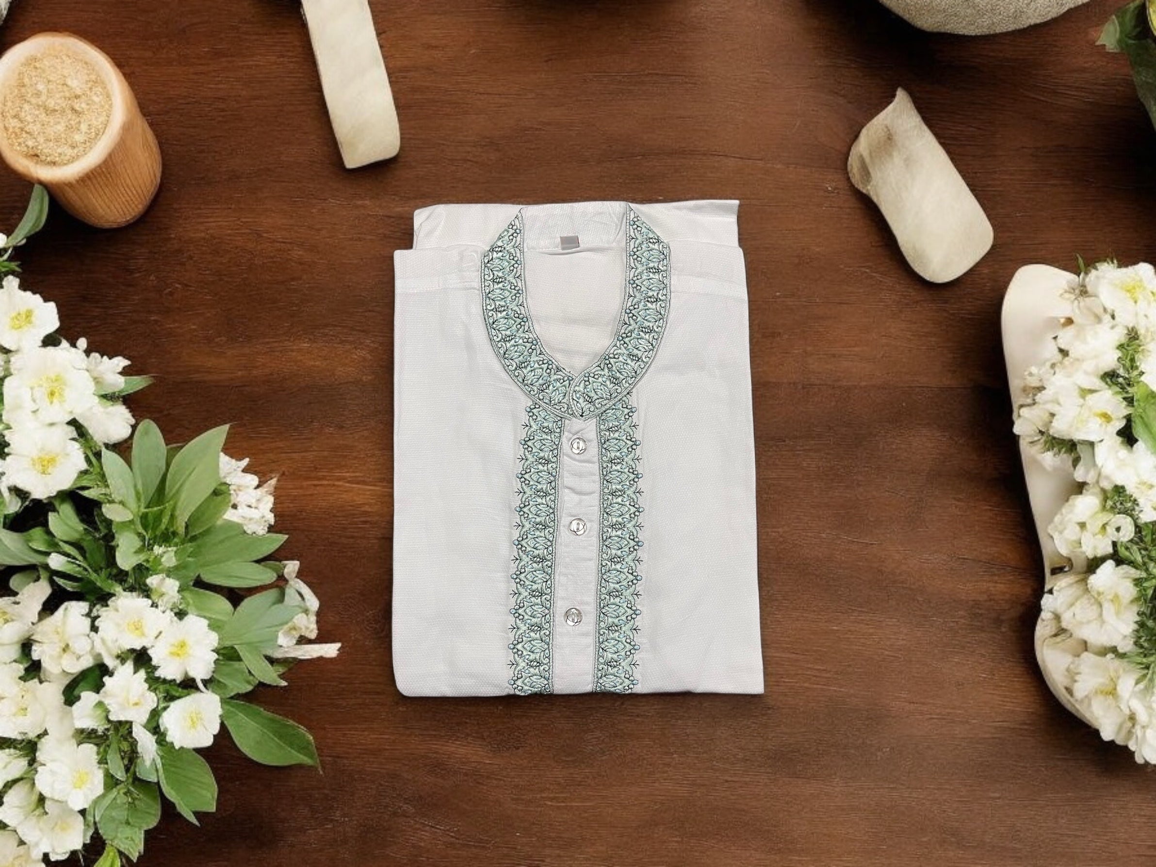 White cotton men's kurta by Saree Ghor Charlotte featuring traditional style and classic design for timeless elegance.