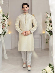 Cream-colored traditional silk kurta pajama for men, featuring intricate jacquard design, by Saree Ghor Charlotte.
