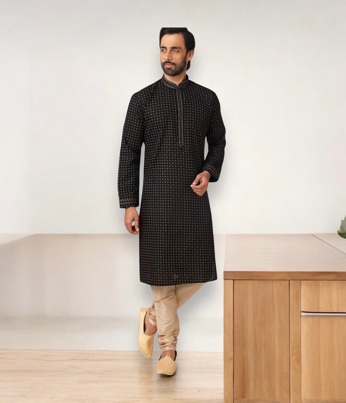 Black cotton men's kurta and pajama set by Saree Ghor Charlotte, traditional ethnic wear for men, shown on a model.